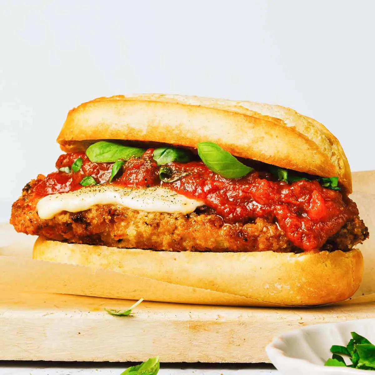 Chicken parmesan sub with marinara, melted cheese and basil